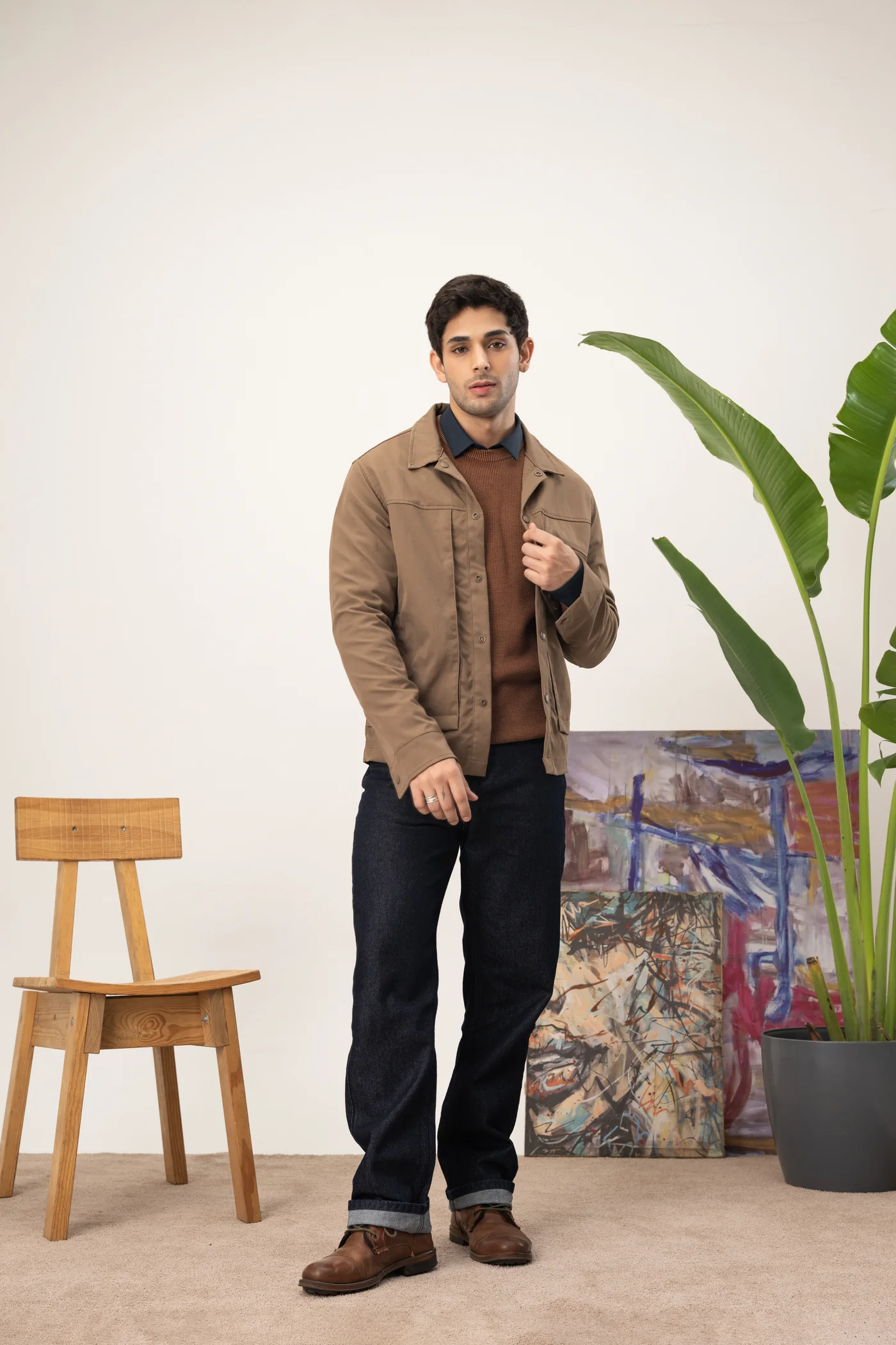 Brown winter jacket layered over a tonal knit