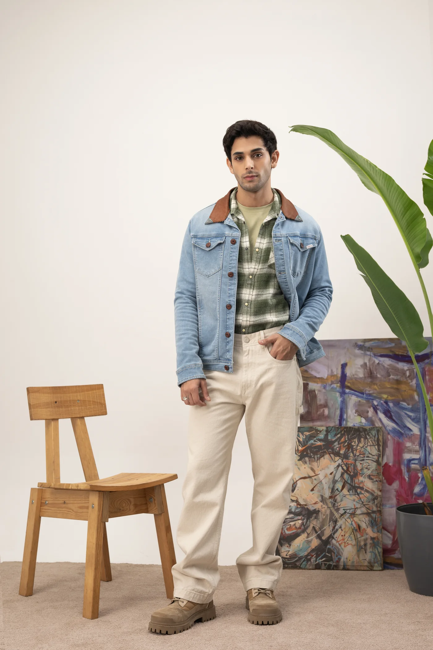 Light blue denim jacket over a green checked shirt