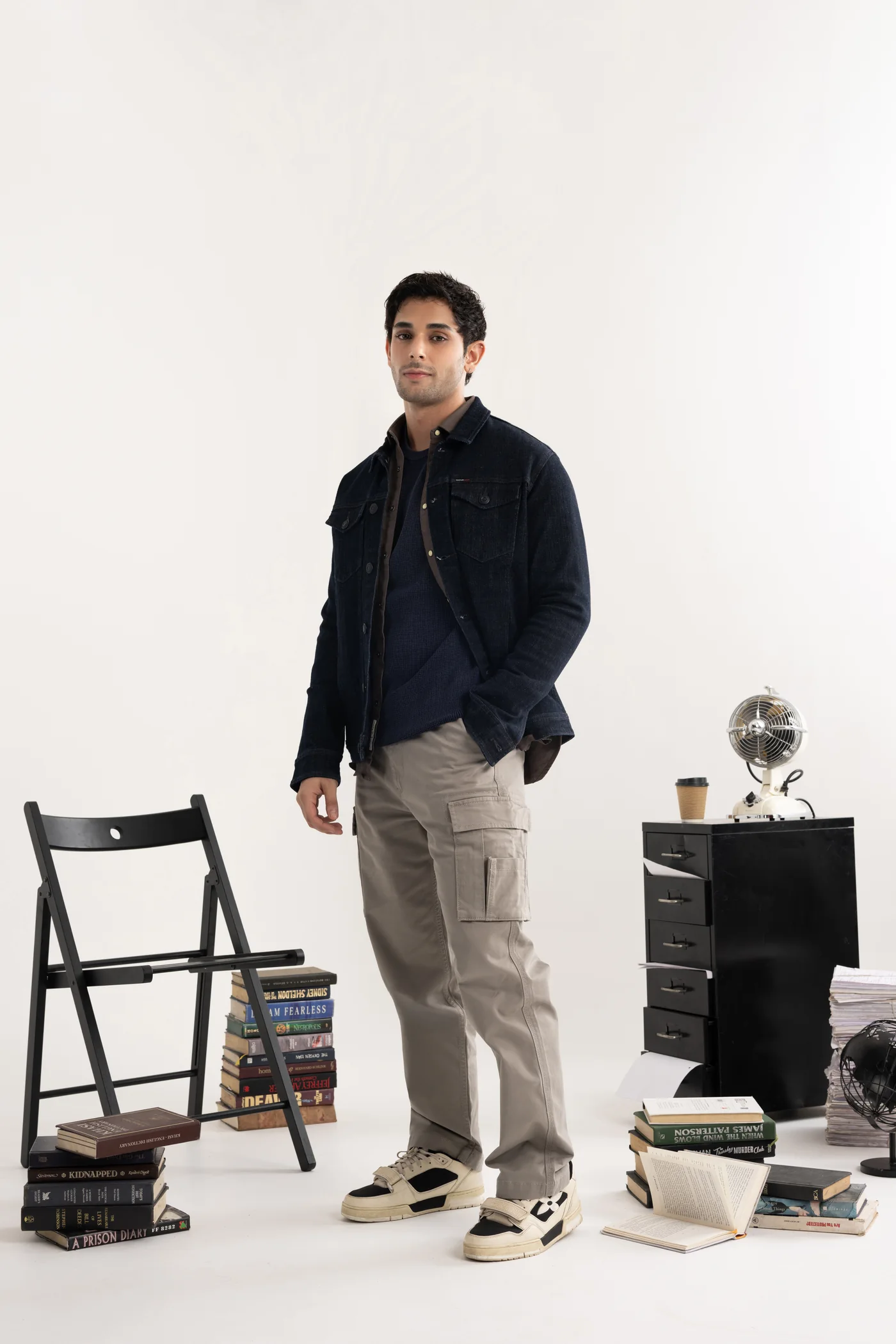 Indigo chore jacket with a brown plaid shirt