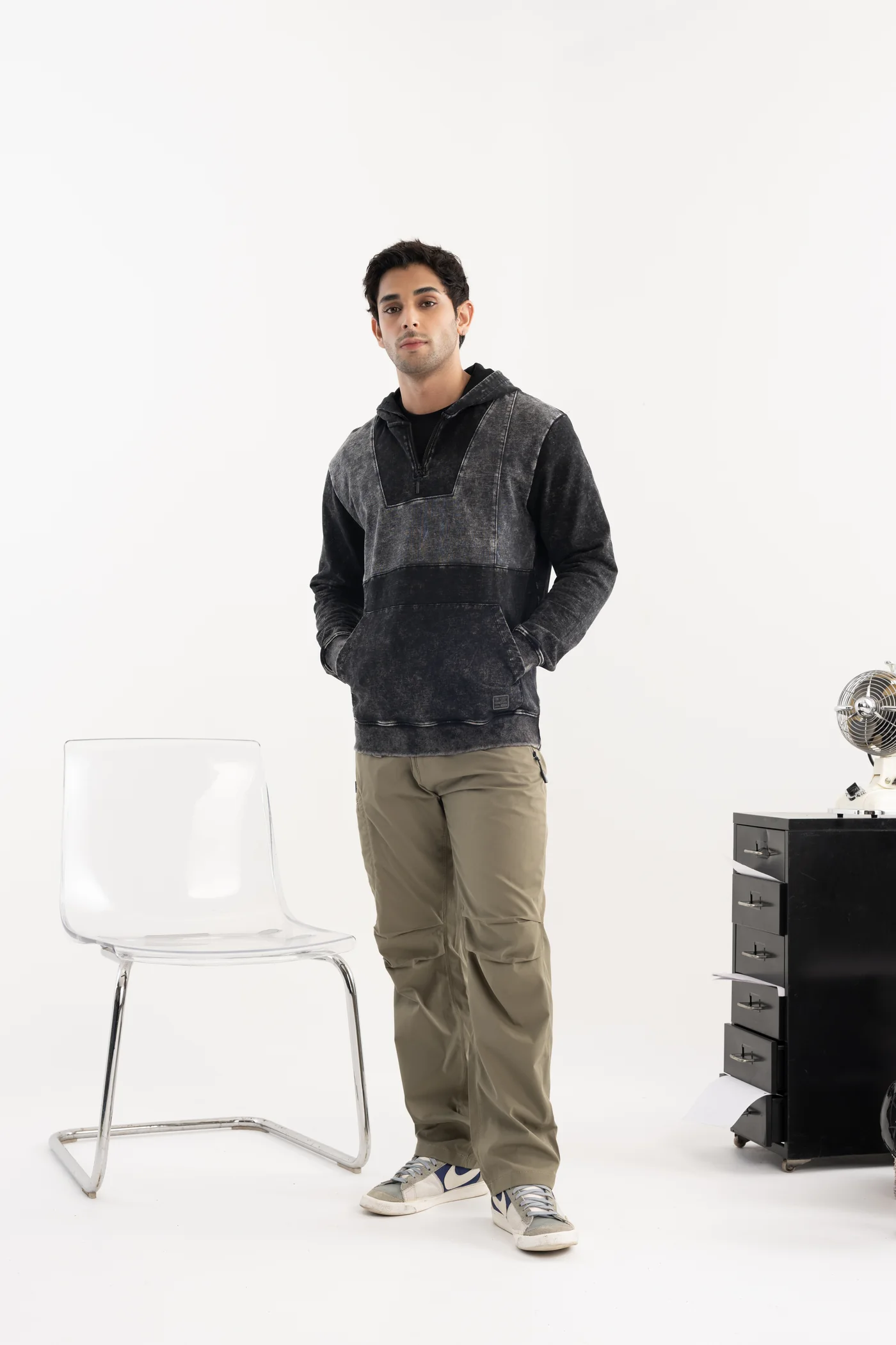 Washed charcoal hoodie with khaki trousers